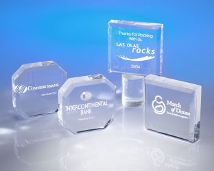 Crystal and Plexiglass awards and paper weight with custom engraving for various organizations