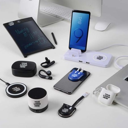 Assorted tech gadgets with custom logos on a desk