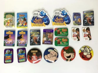 Collection of vintage promotional magnets for movies and brands.